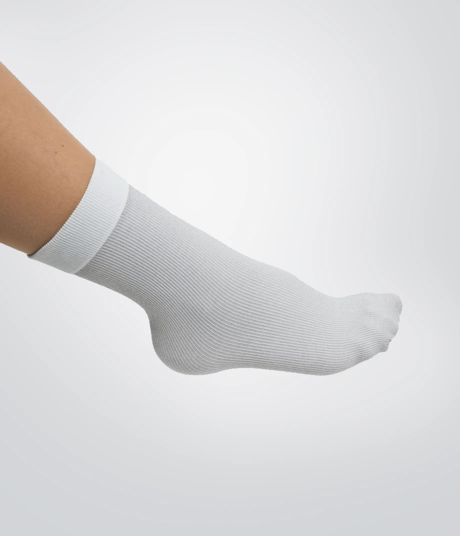 Model wearing Compressana INTRA Silver Under Socks on the right side