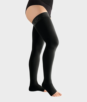 A female model worn thigh high compression stocking Juzo Move Open Toe